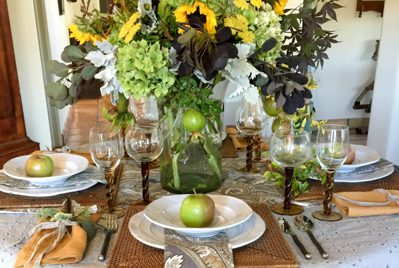 Thanksgiving tablescape table setting idea with apples and neutrals by Rough Luxe on Hello Lovely