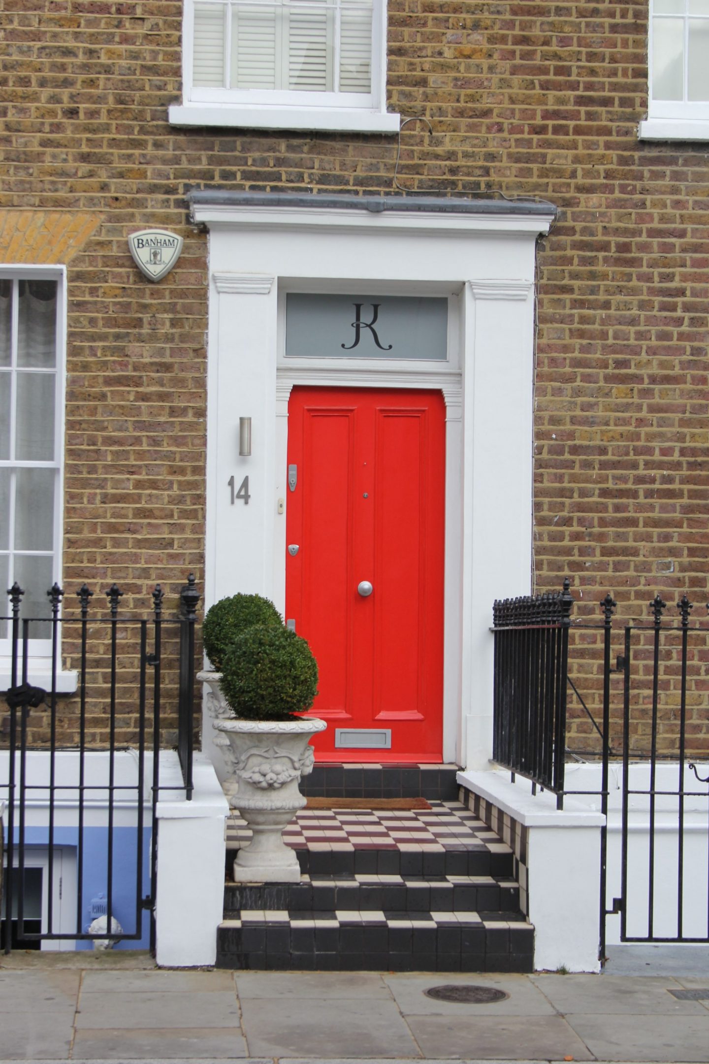 Elegant black and red front doors, Greater London, England, UK