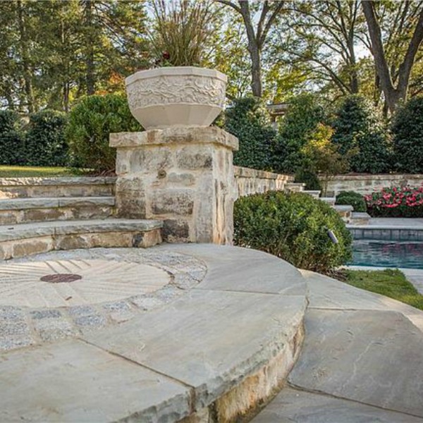 Elegant stone patio at an elegant historic home with Old World style and beautifully classic European inspired interiors in Marietta Georgia was built for the Kennedy-DuPre family. See more in Traditional Style House Tour: 1935 English Tudor on Hello Lovely Studio.