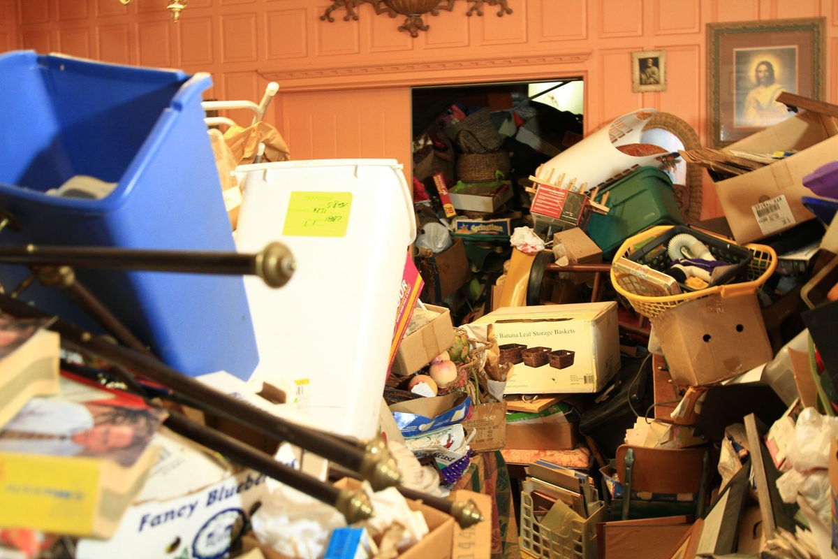 Julian Price Mansion on 'Hoarders' before photo of kitchen piled high with stuff.