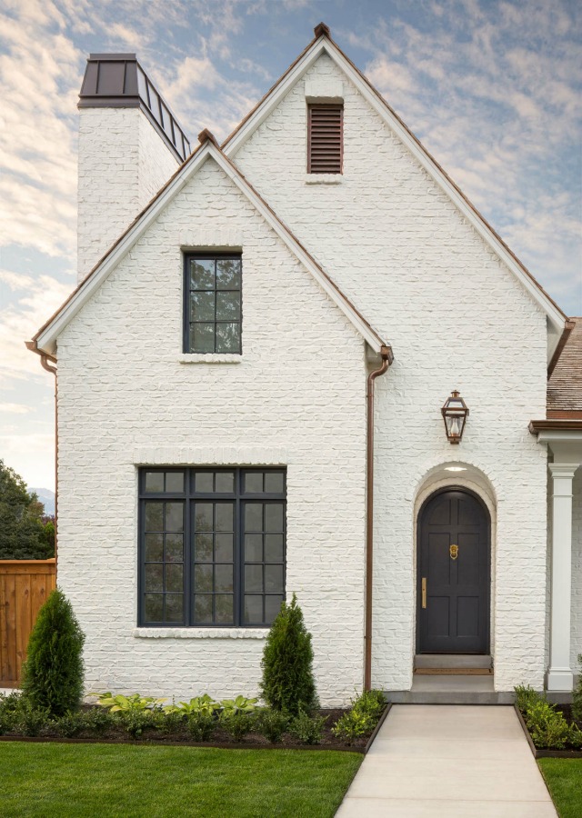 White painted brick beautiful home exterior by The Fox Group. Come discover White Homes + A Few Bright White Exterior Paint Colors