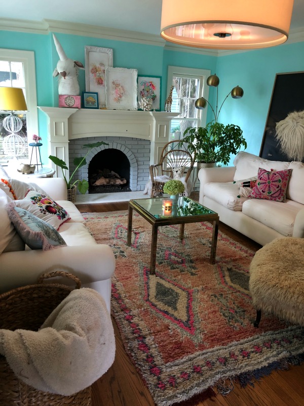 Turquoise painted living room. Be inspired by this photo gallery of vibrant colorful beachy boho interior design from artist Jenny Sweeney's Chicagoland home. Her art has been lifting spirits and opening hearts to wonder - see how it lives large in a charming suburban Tudor!