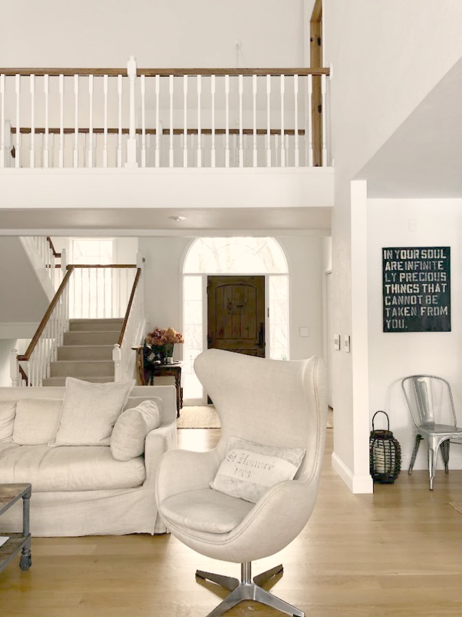 Living room with Copenhagen egg chair (RH), staircase and catwalk - Hello Lovely Studio. #livingroom #belgianstyle