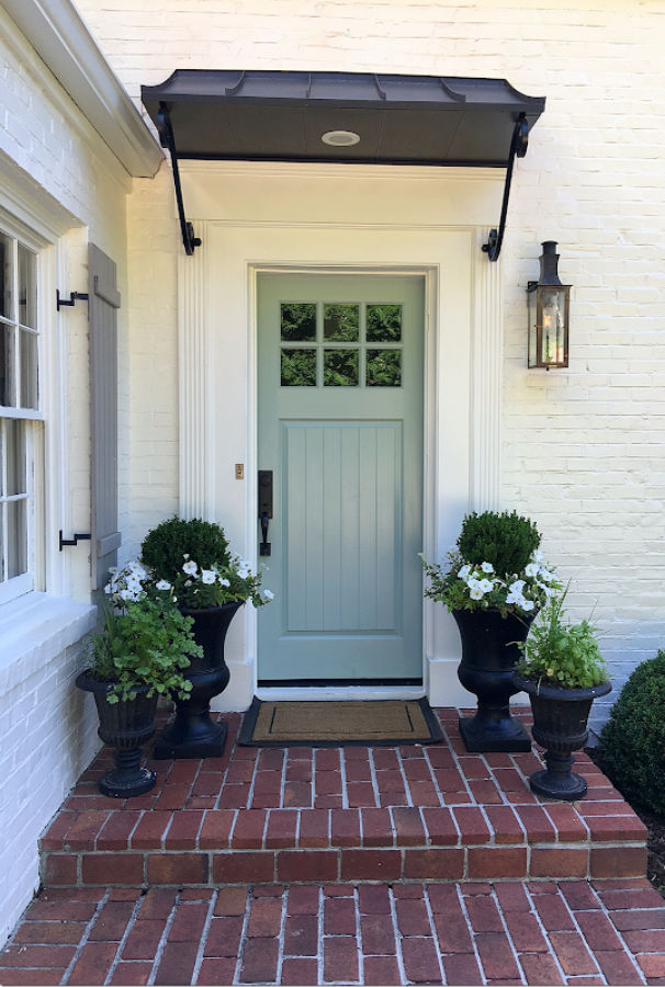 Benjamin Moore Wythe Blue front door on a beautiful white (SW Alabaster) brick home - built by Michael Ladisic. #benjaminmoorewytheblue #paintcolors #frontdoor
