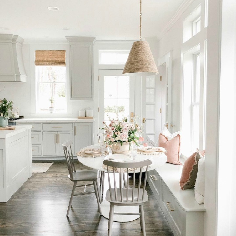 Elegant white farmhouse kitchen with Benjamin Moore Repose Grey cabinets, subway tile, gold accents, and reclaimed barn wood. Design: Finding Lovely. Wall color: Benjamin Moore Chantilly Lace. #paintcolors #bestwhites #interiordesign