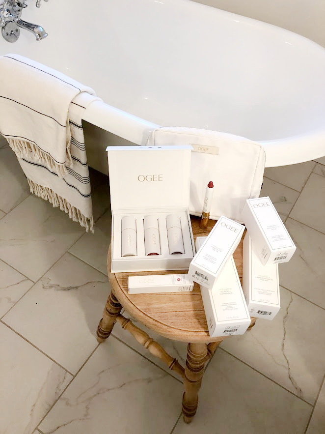 OGEE skincare and makeup goodies in their exquisite white and gold chic packaging in my bathroom ready to sample - Hello Lovely Studio. #ogee #beautyover50 #skincare