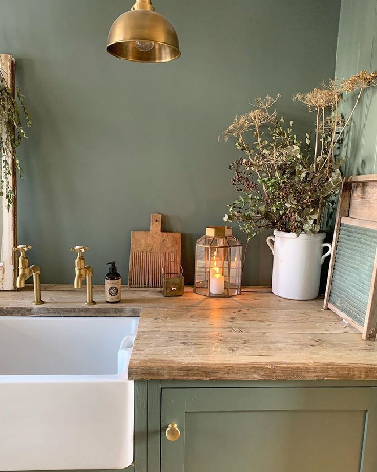 Green Smoke (Farrow & Ball) painted wall and cabinets in laundry room = Simply Scandi Katie. #laundryrooms #greensmoke