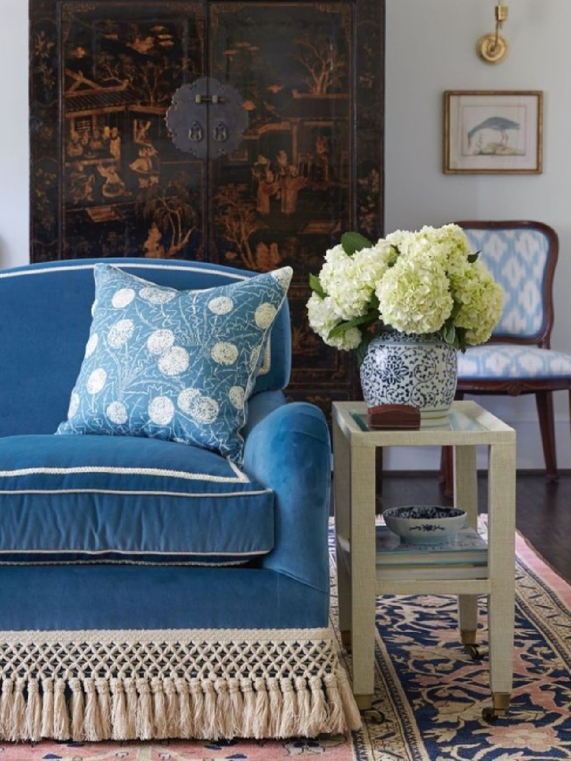 Blue velvet sofa in living room with fringe. Lovely timeless interior in a Birmingham home by Caroline Gidiere. James F. Farmer, architect. #timelessinteriors #birminghamhomes