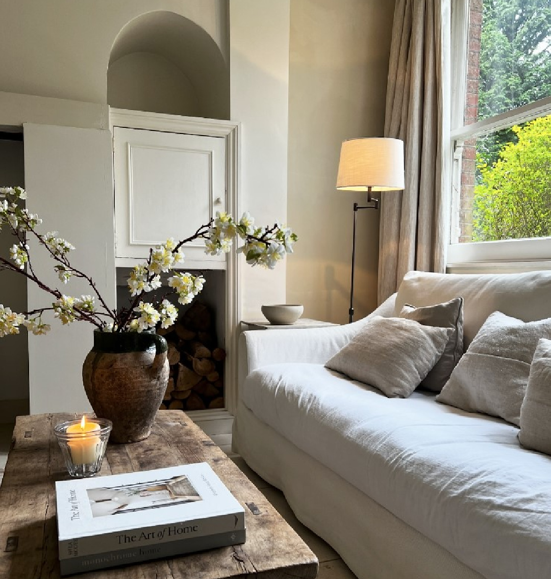 Belgian linen sofa in a cozy living room - @heritageparkinteriors