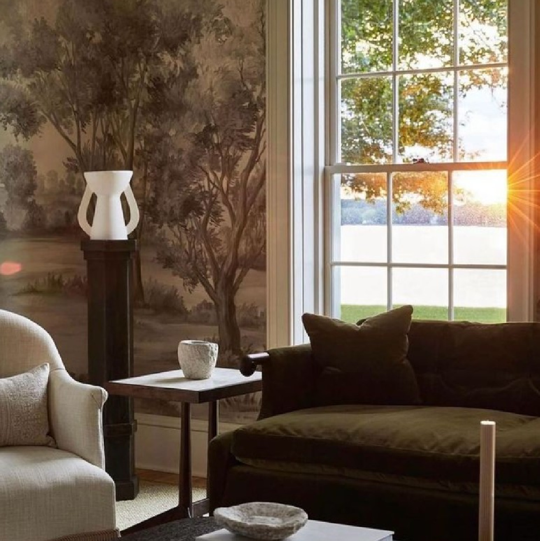 @hadleyjameshome - a beautiful timeless living room with green velvet sofa and scenic grisaille mural n in an Easton, Maryland home. #europeanluxury #cozyopulence #timelessinteriors