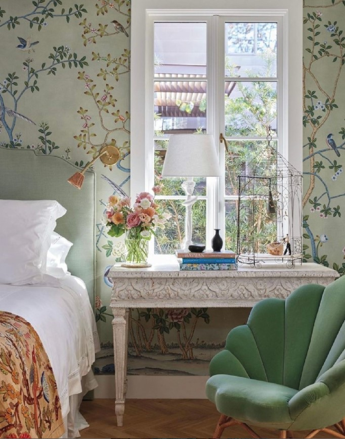 Romantic modern French bedroom with DeGournay wallpaper, Schumacher green velvet chair, and Italian carved console table in a French home in Houston (Cynthia Davis interior design) featured in MILIEU (photo: Brett Wood). #modernfrench #romanticbedrooms