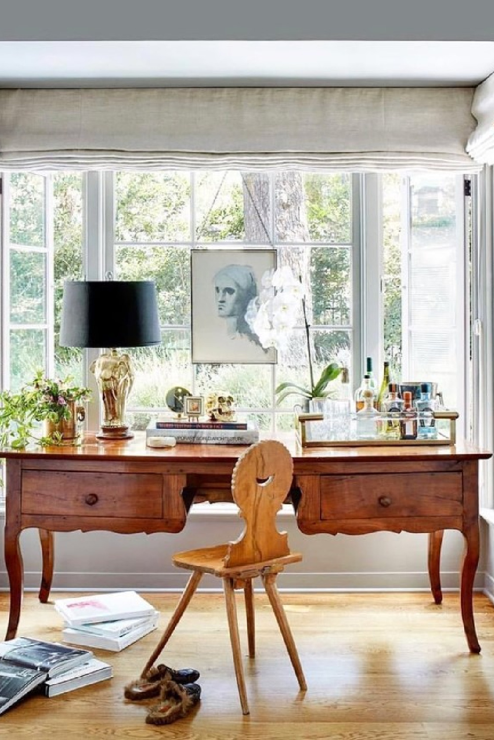 Beautiful antique desk with bar essentials in tray - @architecturaldigest (@pierceandward). #homeoffice