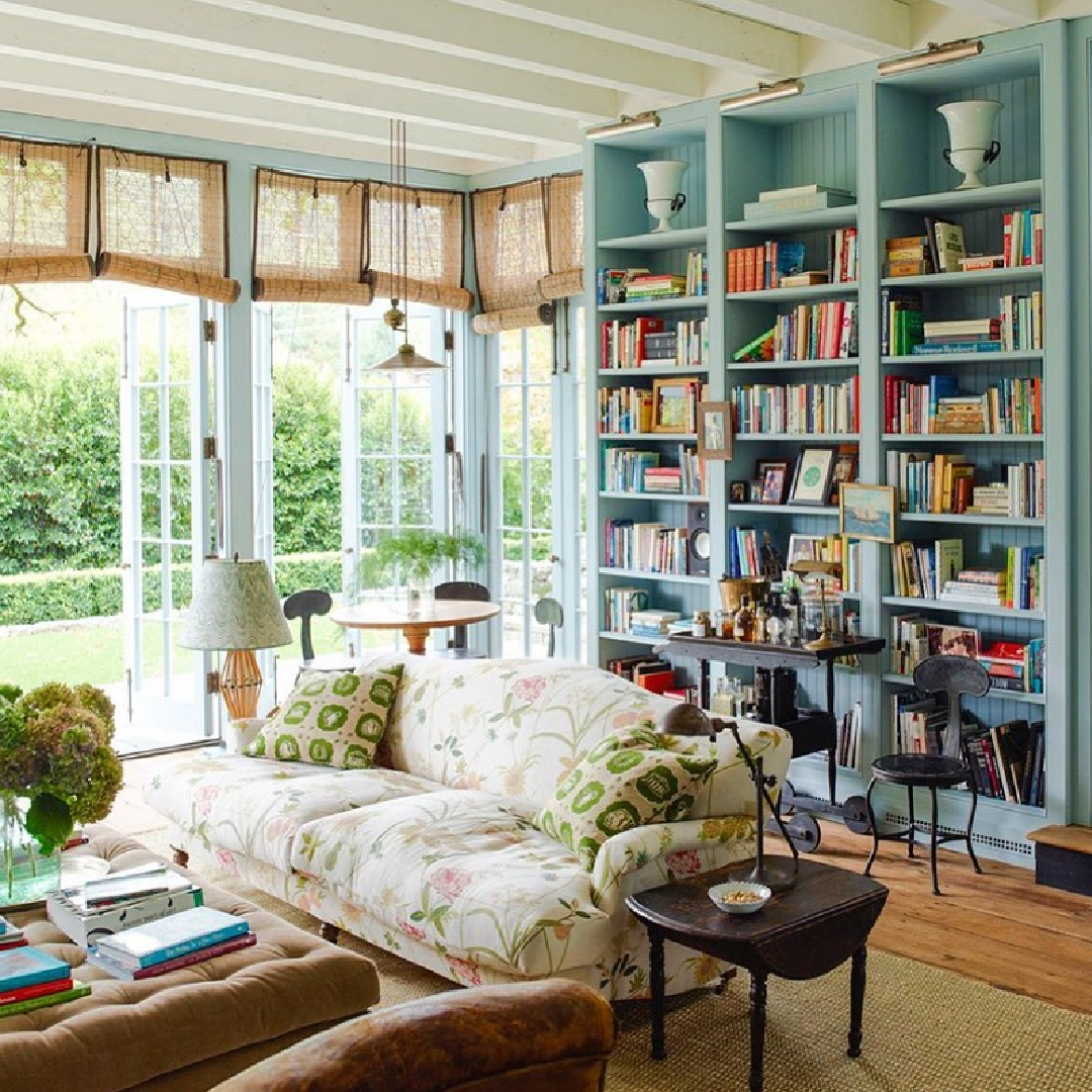 Charming traditional family room with built-in bookshelves painted Robin's Egg Blue - @ritakonig.