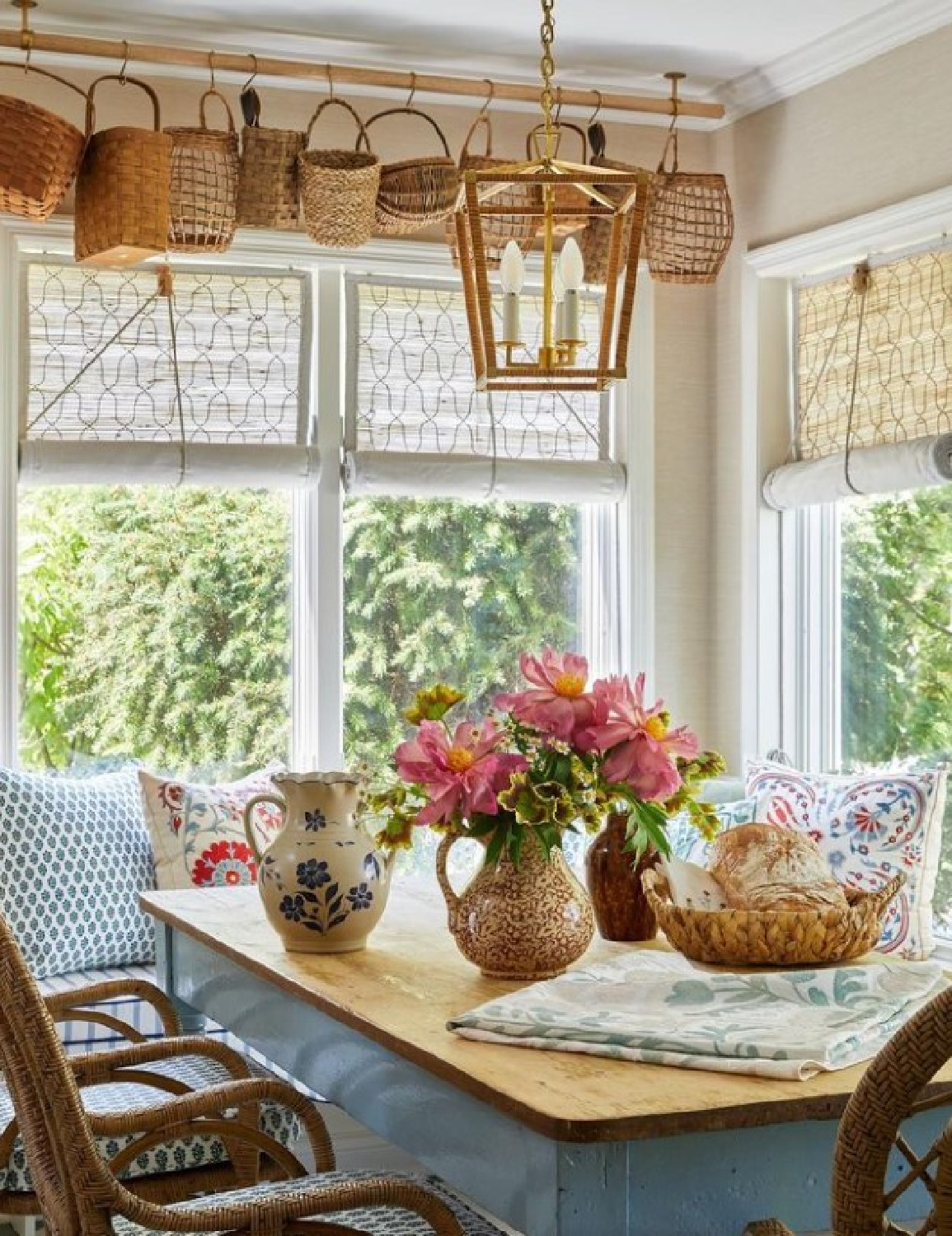 Beautiful modern vintage classic timeless kitchen with banquette, chick blinds, and vintage baskets. @stephperezstudio