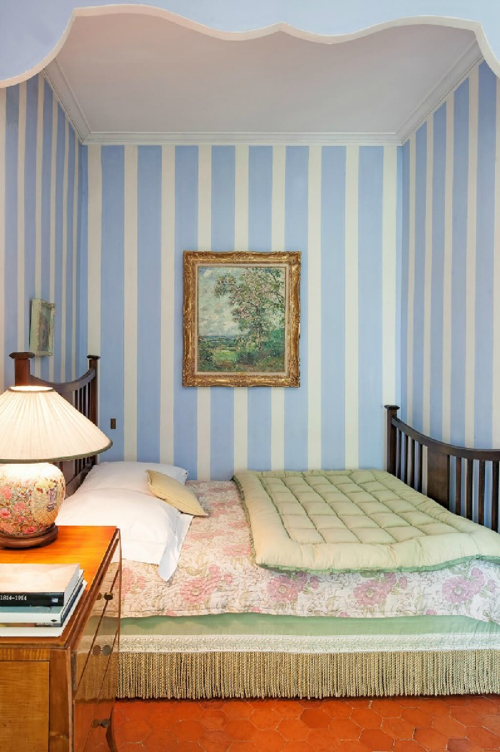 French blue striped walls in a bedroom at Chateau Mireille in Provence - Haven In. #frenchbedroom #frenchblue