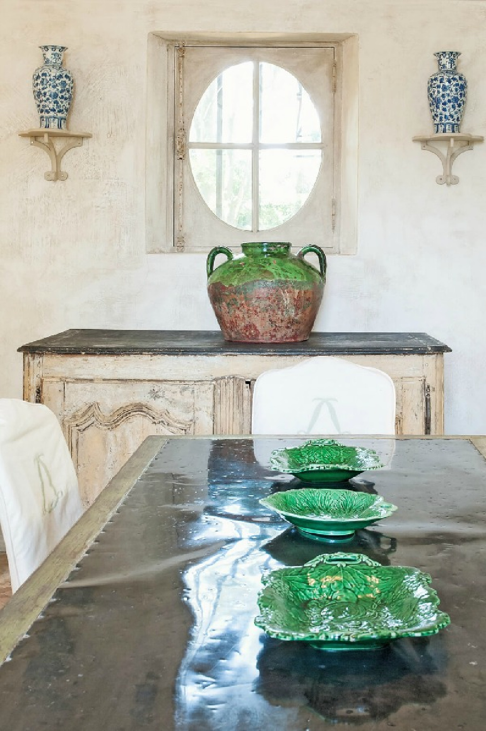 Green dishes in beautiful Old World French Chateau Mireille - Haven In. #frenchcountrydiningroom 