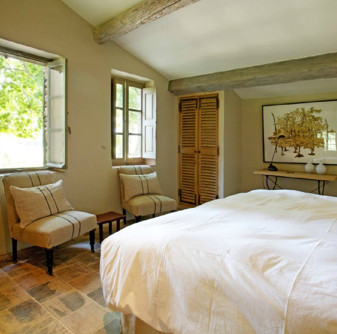 Authentic French farmhouse bedroom in Bonnieux Villa vacation rental in Provence - warm stone floors and Old world style - Your Haven in Paris.