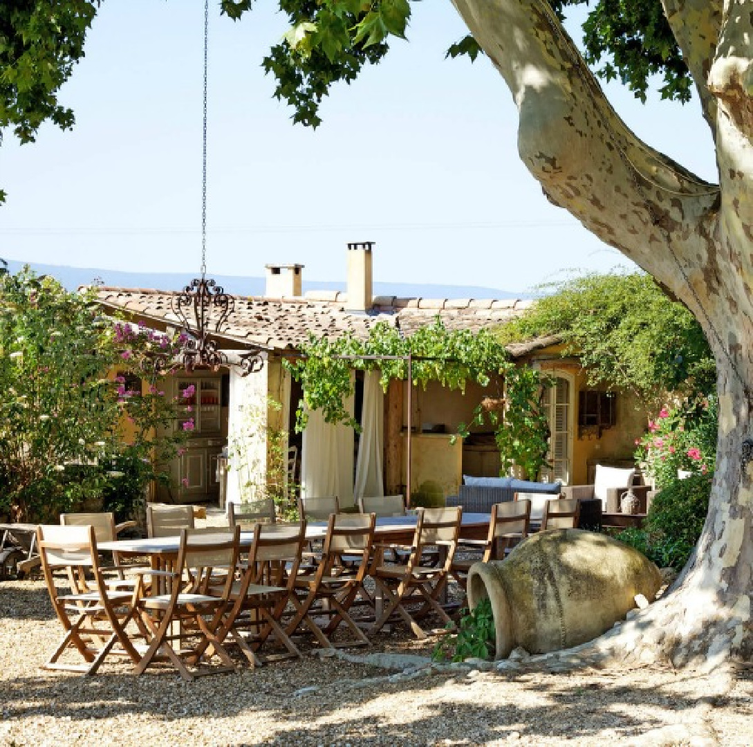 French country courtyard at Provence farmhouse Bonnieux Villa vacation rental from Your Haven In Paris. Romantic Old World rustic elegant interiors and enchanting South of France gardens.