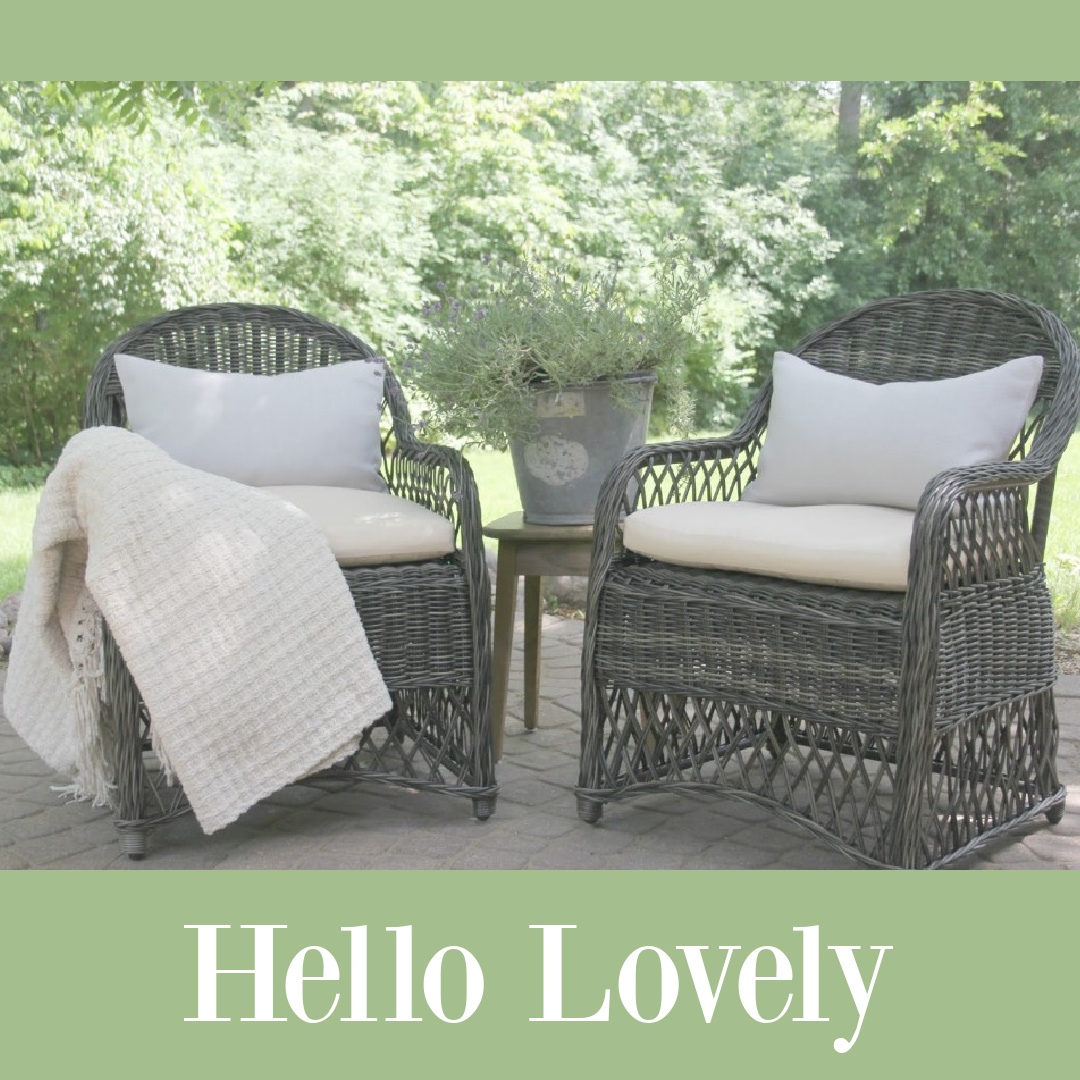 Hello Lovely's rattan chairs with ivory linen cushions on our patio.