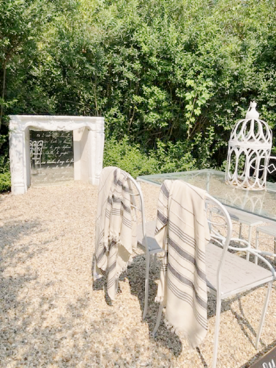 Turkish towel (Thriae) with charcoal stripes on my vintage dining chairs in the courtyard - Hello Lovely Studio. #turkishtowels