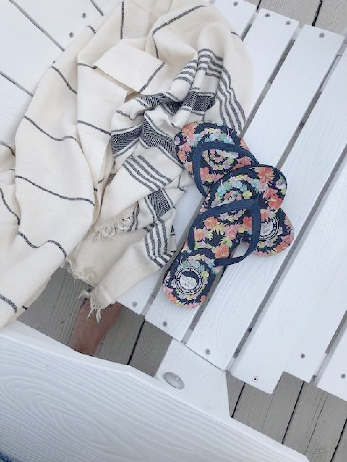 Turkish towel (Thriae) with charcoal stripes on my Adirondack chairs with flip flops - Hello Lovely Studio. #turkishtowels