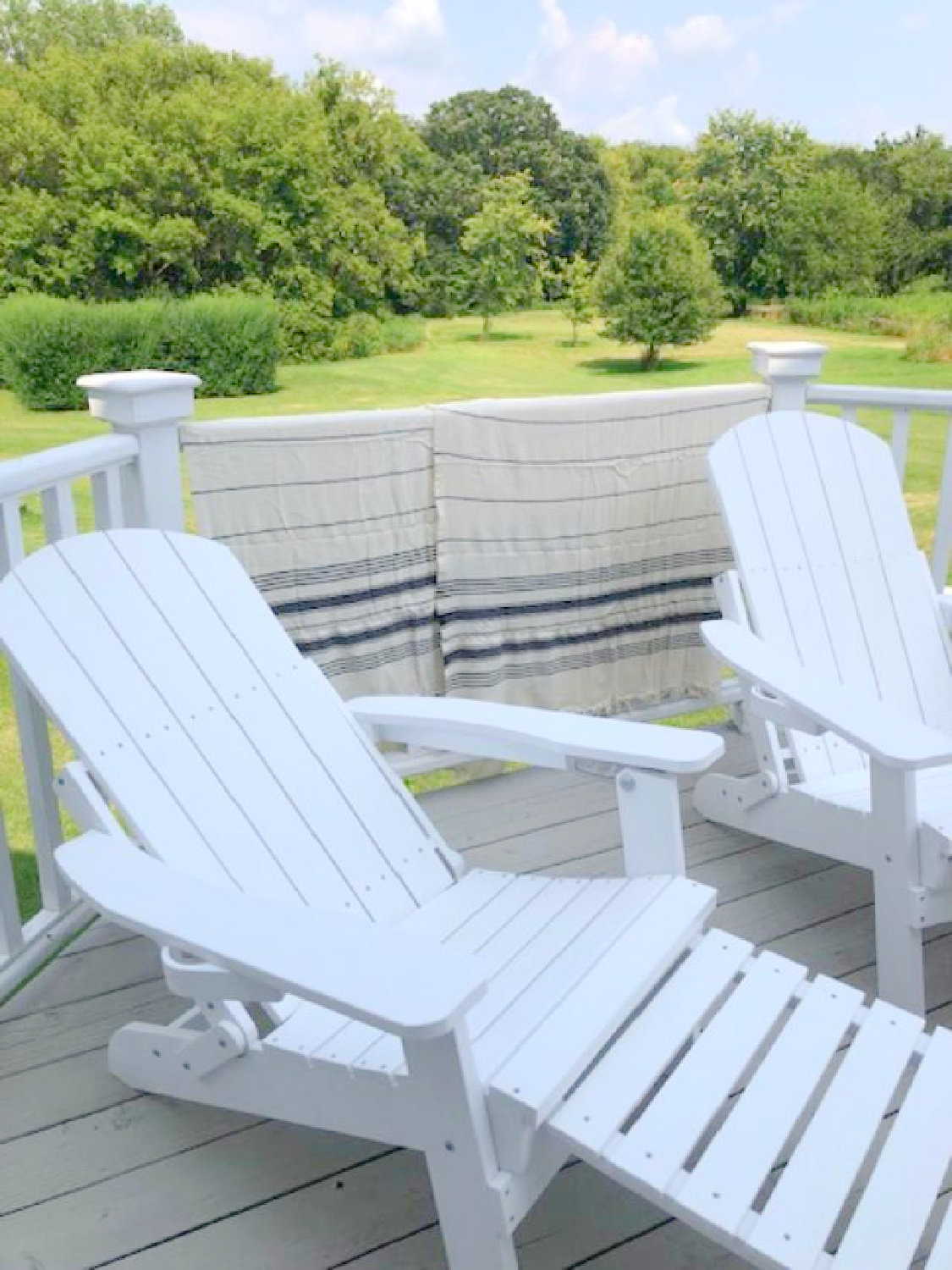 Turkish towel (Thriae) with charcoal stripes on my white deck with Adirondack chairs - Hello Lovely Studio. #turkishtowels