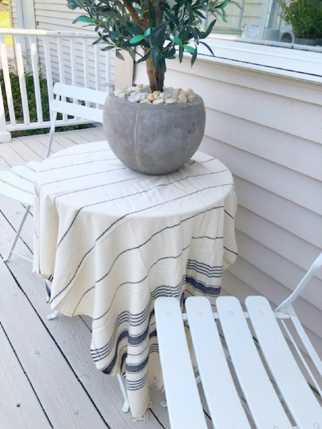 Turkish towel (Thriae) with charcoal stripes as tablecloth on my white bistro set on deck - Hello Lovely Studio. #turkishtowels