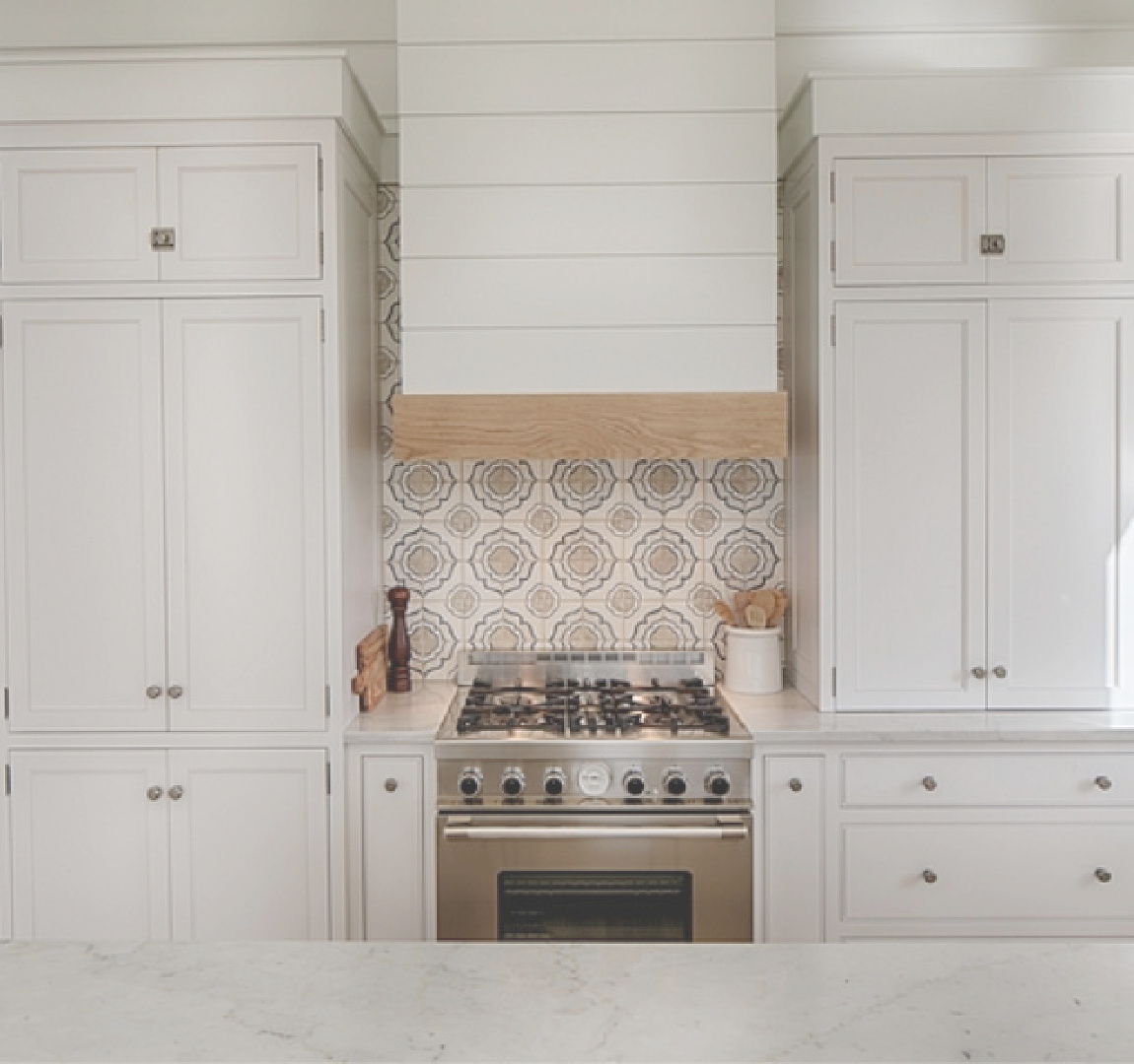 Lisa Furey designed modern farmhouse kitchen with shiplap range hood and handpainted backsplash tile.