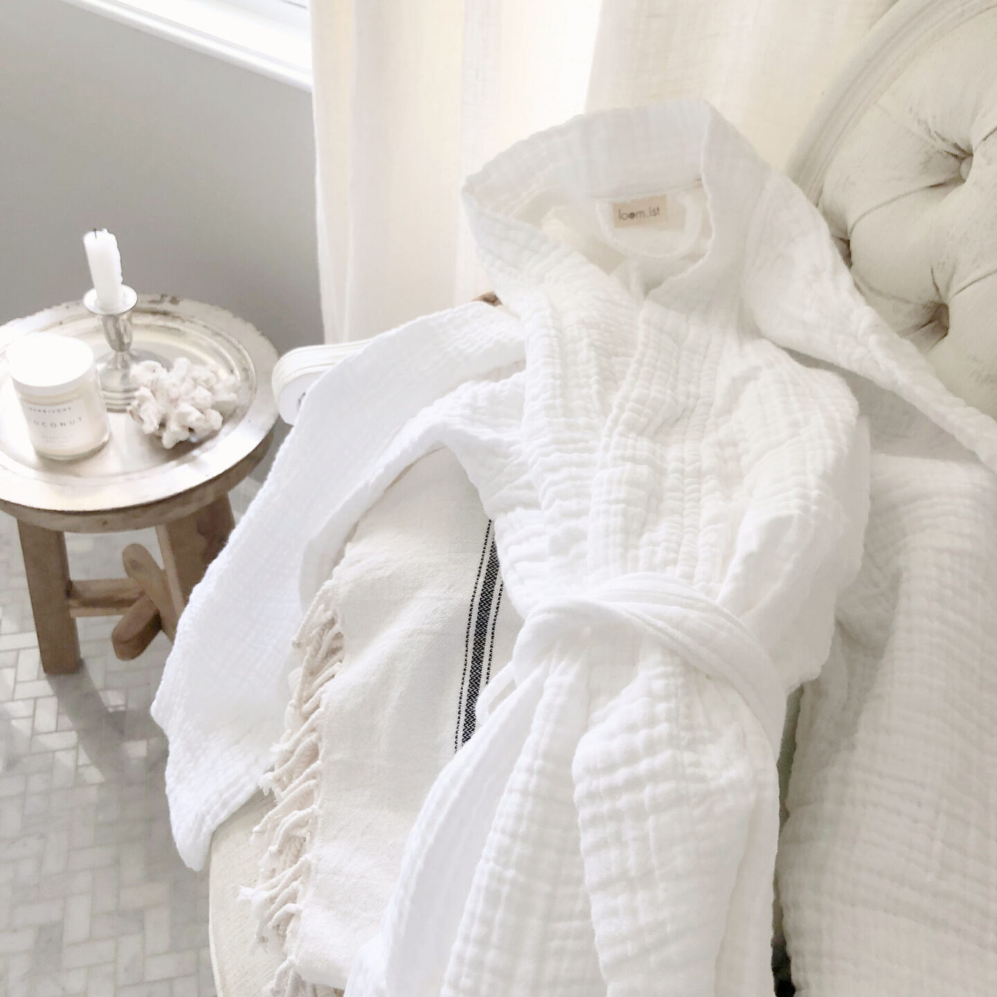 Loom.ist white muslin robe from Aware House in Hello Lovely's serene renovated bath with marble herringbone floors and SW Repose Gray painted walls. #reposegray