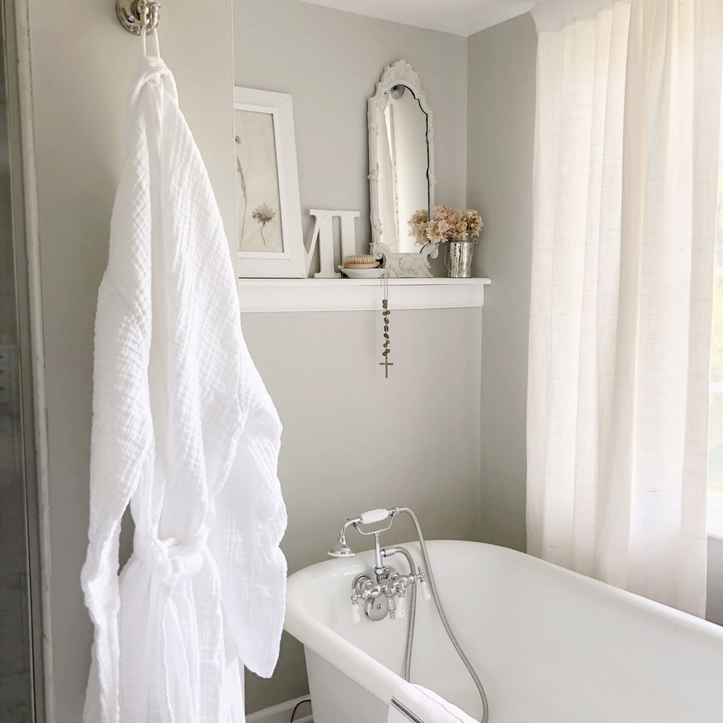 Serene bath with clawfoot tub and white Turkish muslin robe (Loom.ist) from Aware House. Wall color is SW Repose Gray - Hello Lovely Studio. #reposegray