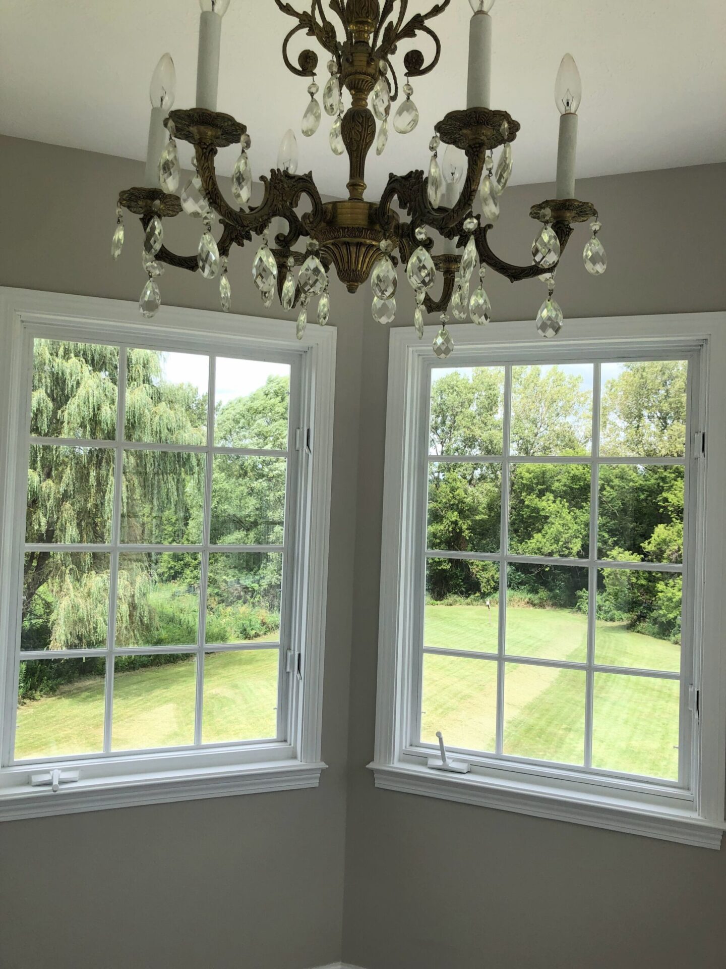 View of late summer backyard and garden from bedroom sitting area - Hello Lovely Studio.