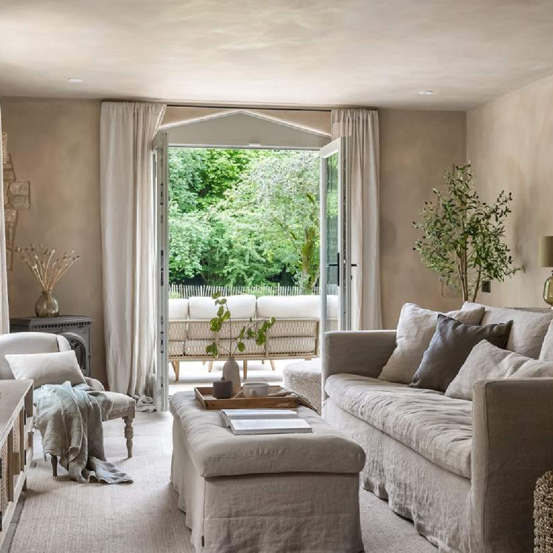 Living room at Amoretta - luxury Cotswolds cottage in Stow-on-the-Wold with rustic elegant interiors and stone - offered by Boutique Retreats in the UK. #cotswoldscottage