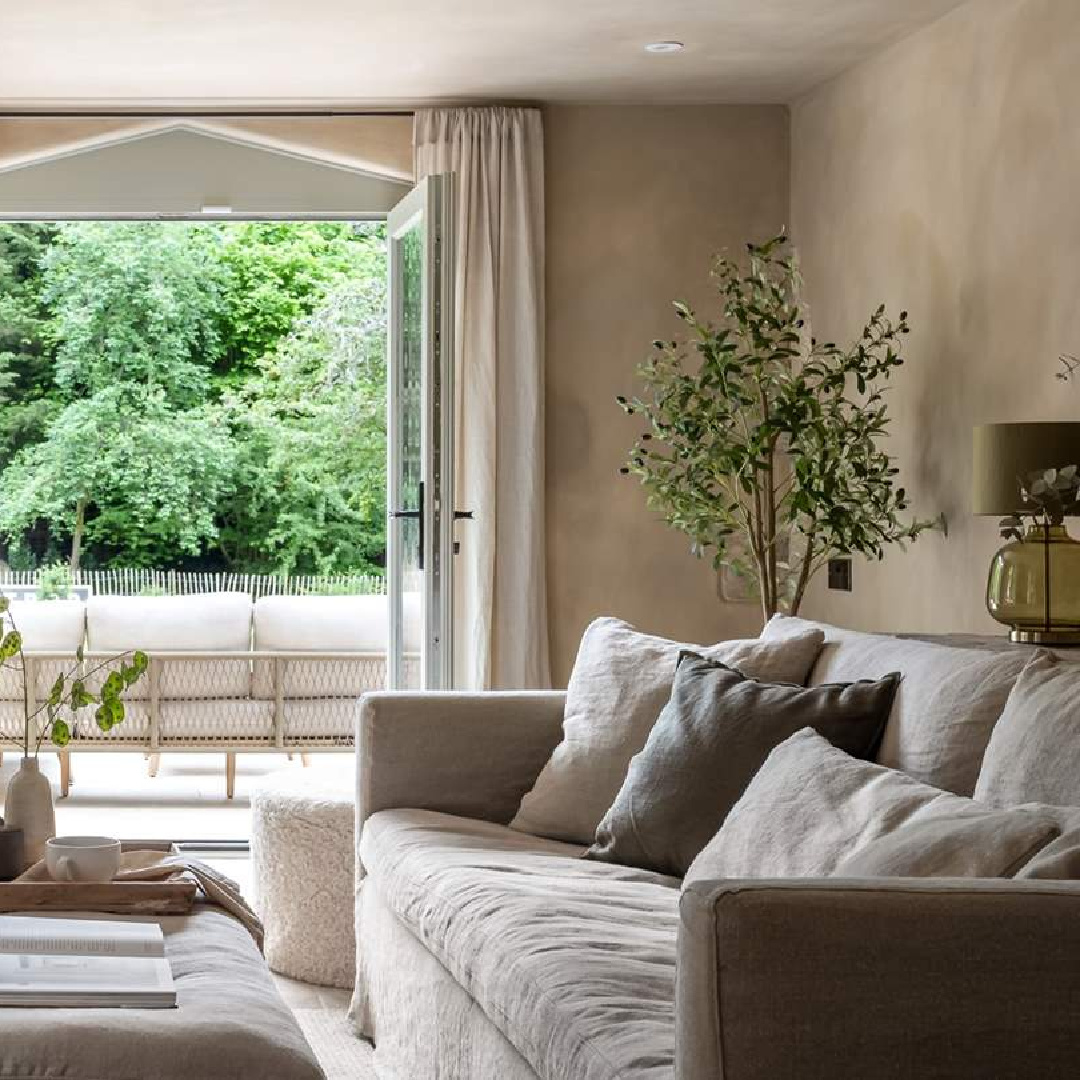 Living room at Amoretta - luxury Cotswolds cottage in Stow-on-the-Wold with rustic elegant interiors and stone - offered by Boutique Retreats in the UK. #cotswoldscottage