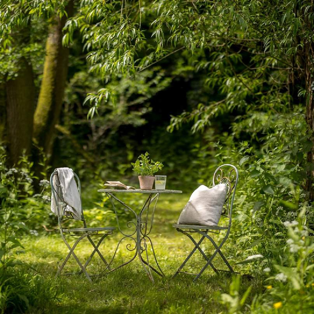 Iron bistro set at Amoretta - luxury Cotswolds cottage in Stow-on-the-Wold with rustic elegant interiors and stone - offered by Boutique Retreats in the UK. #cotswoldscottage