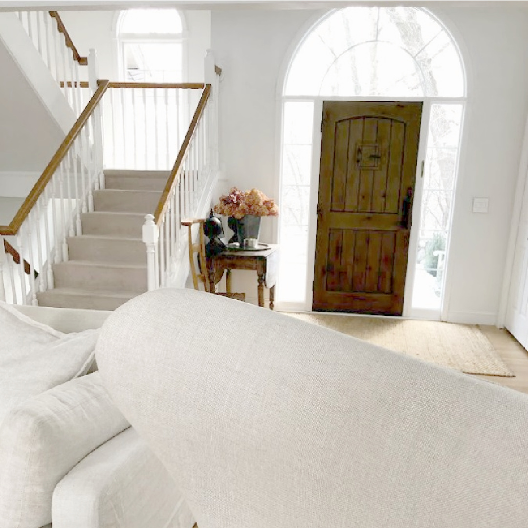 Benjamin Moore White OC-151 on walls, trim, and ceiling of Hello Lovely's living room and entry.