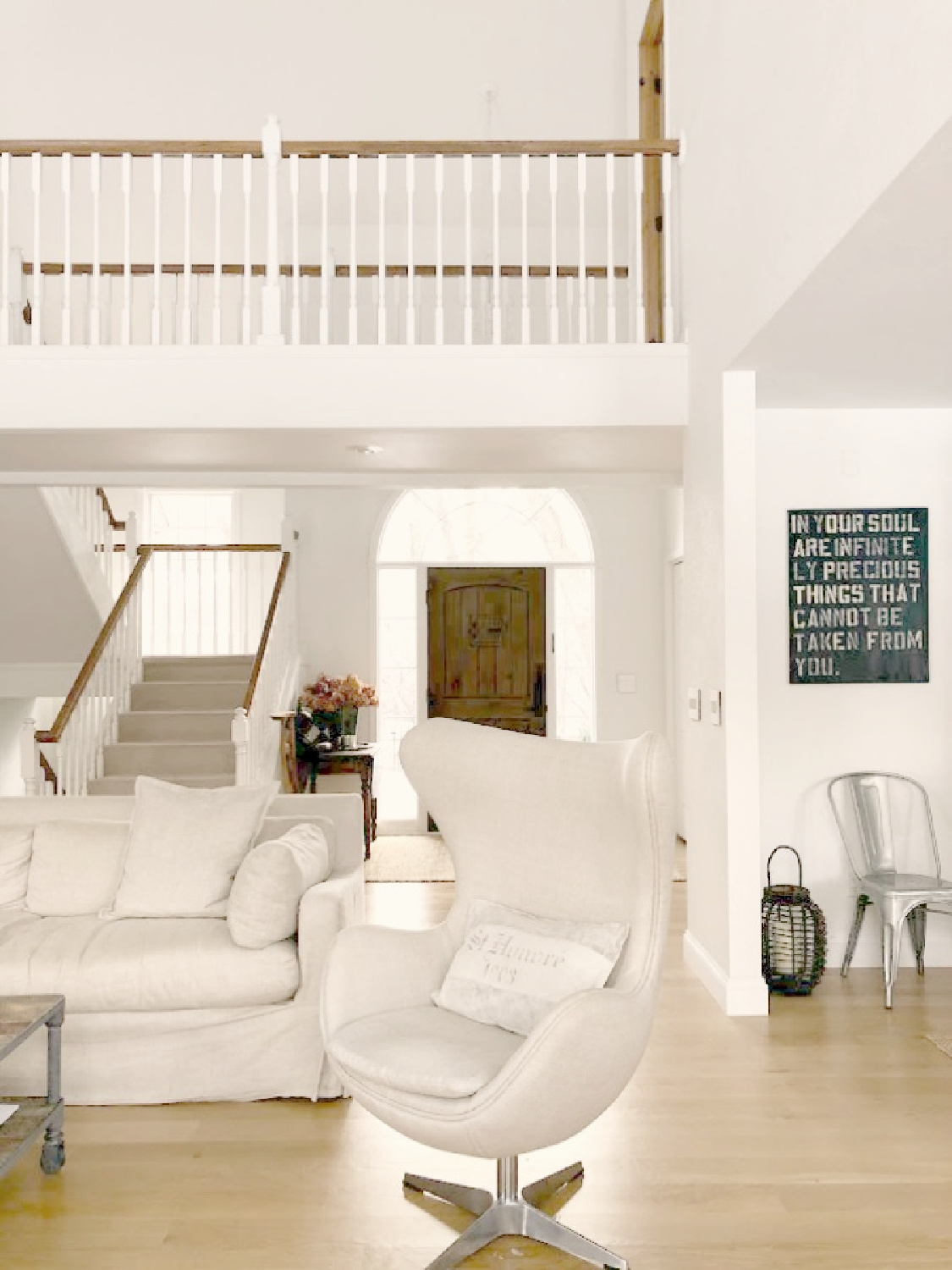 Belgian modern minimal open floor plan with white oak hardwood flooring and Belgian linen upholstered furniture - Hello Lovely Studio.