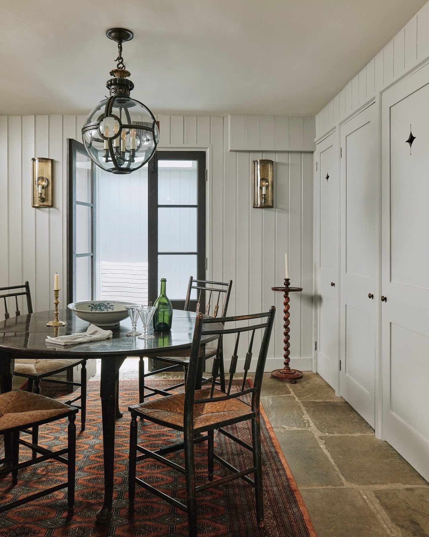 English country dining area with tongue and groove white walls - @houseandgardenuk