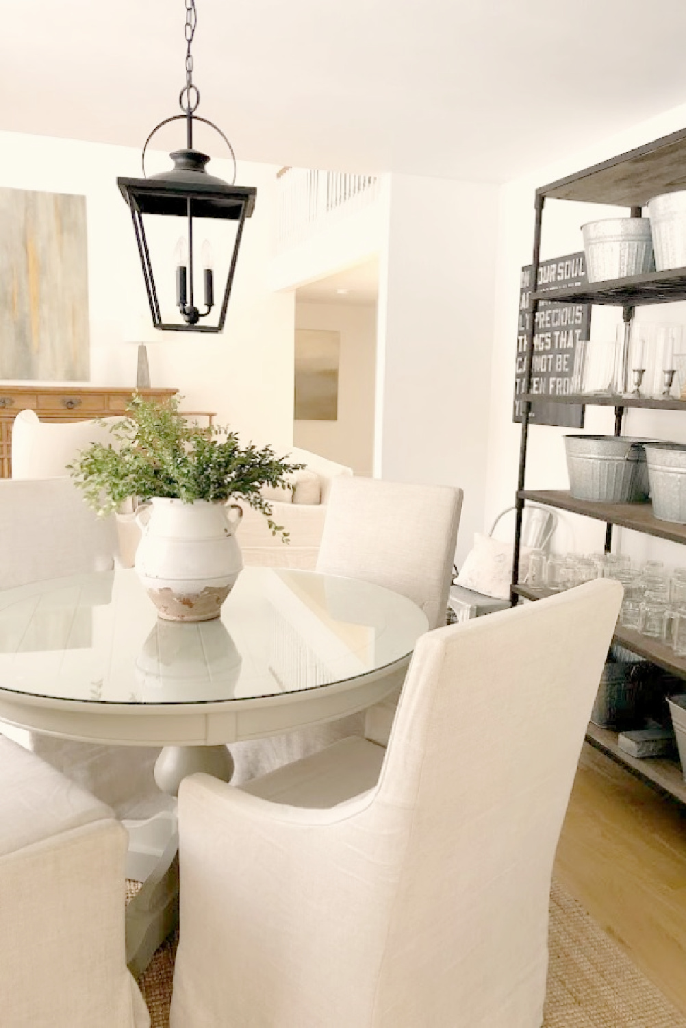 Modern European country dining room and living room with rustic wood shelves and Belgian linen - Hello Lovely Studio.