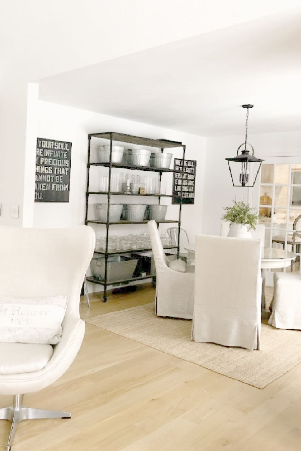 Benjamin Moore White OC-151 on walls, trim, and ceiling in Hello Lovely's modern Belgian dining room.