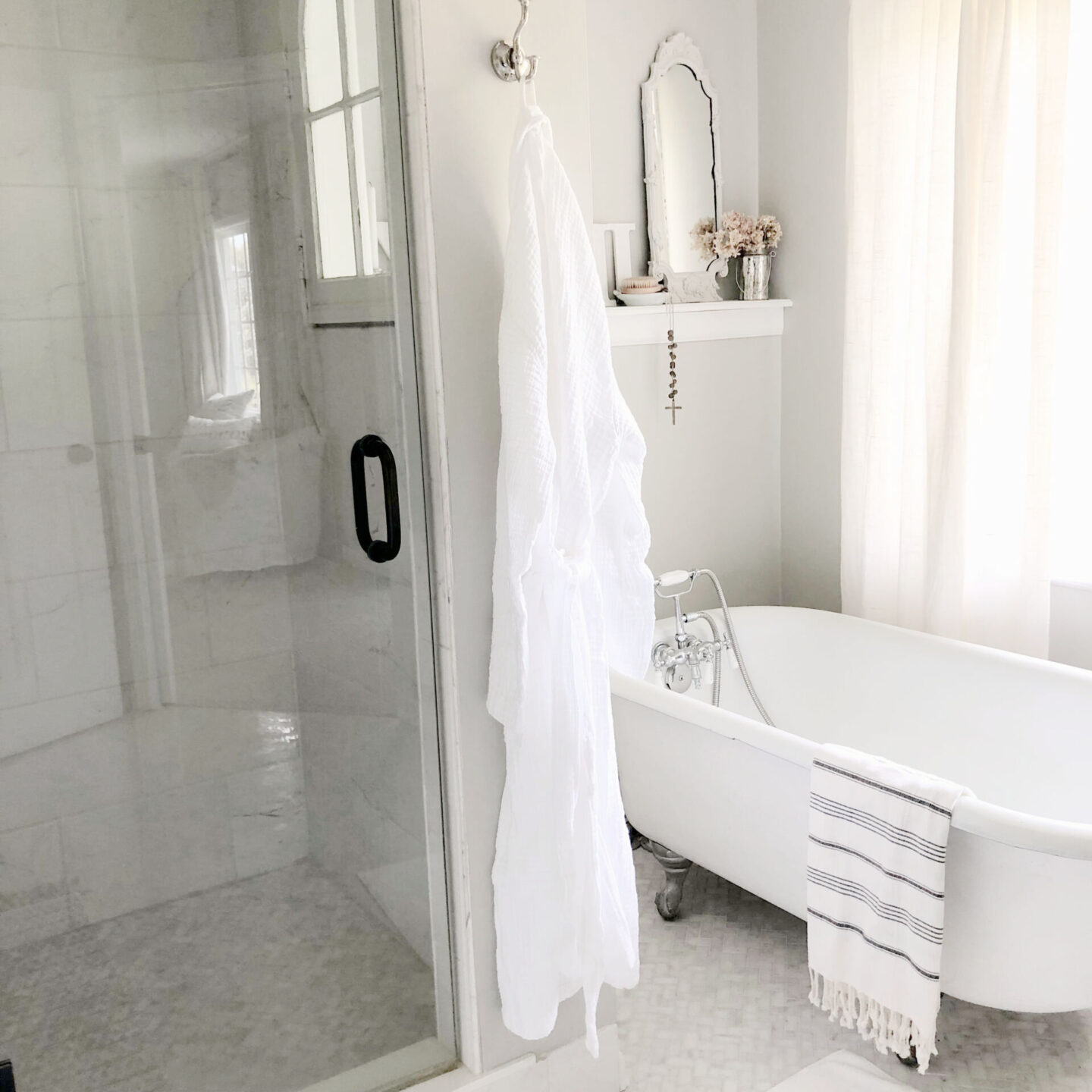 Hello Lovely's DIY renovated classic white bath with clawfoot tub and marble herringbone tile floor. Sherwin-Williams Repose Gray on walls. #sherwinwilliamsreposegray