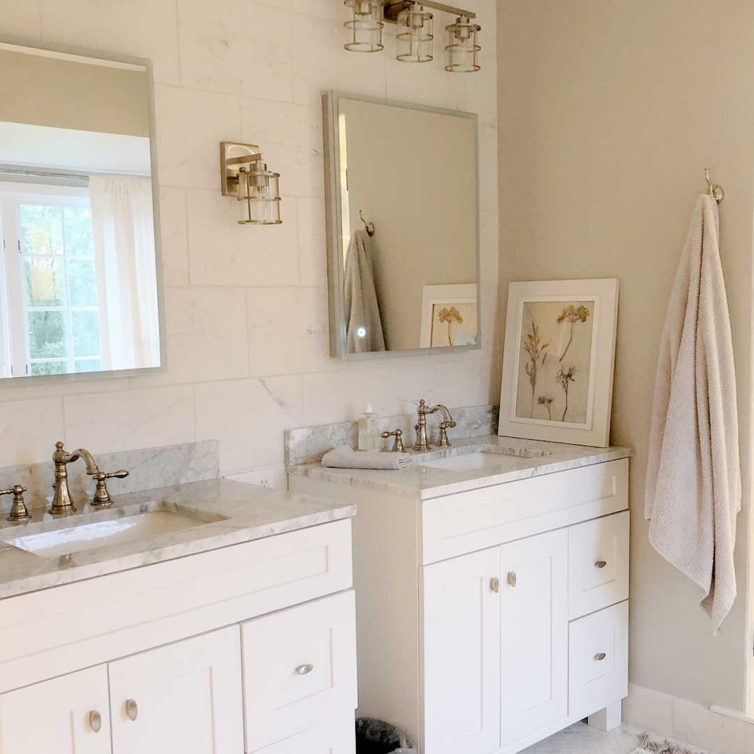 Hello Lovely's DIY renovated classic white bath with clawfoot tub and marble herringbone tile floor. Sherwin-Williams Repose Gray on walls. #sherwinwilliamsreposegray