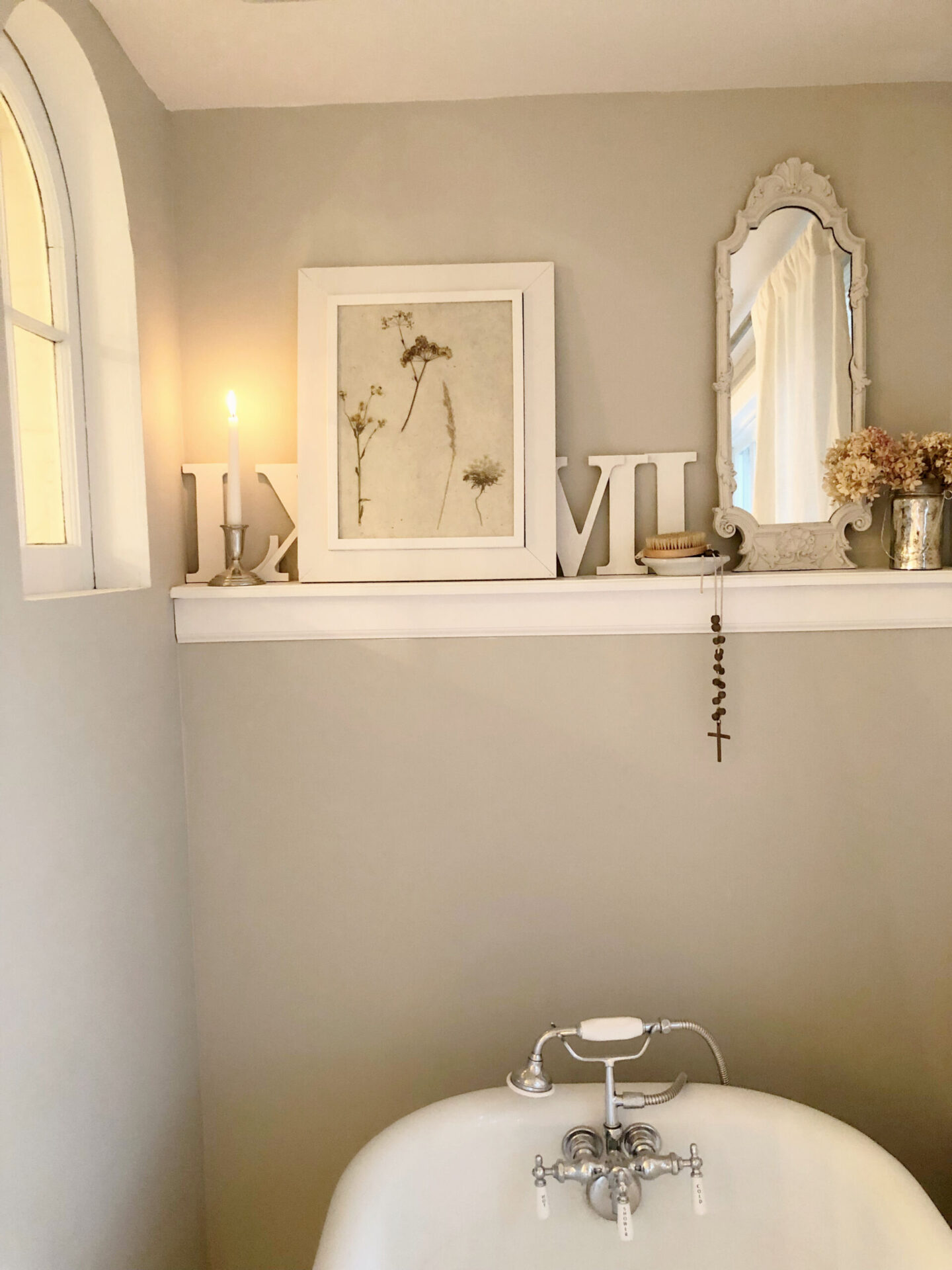 Hello Lovely's DIY renovated classic white bath with clawfoot tub and marble herringbone tile floor. Sherwin-Williams Repose Gray on walls. #sherwinwilliamsreposegray