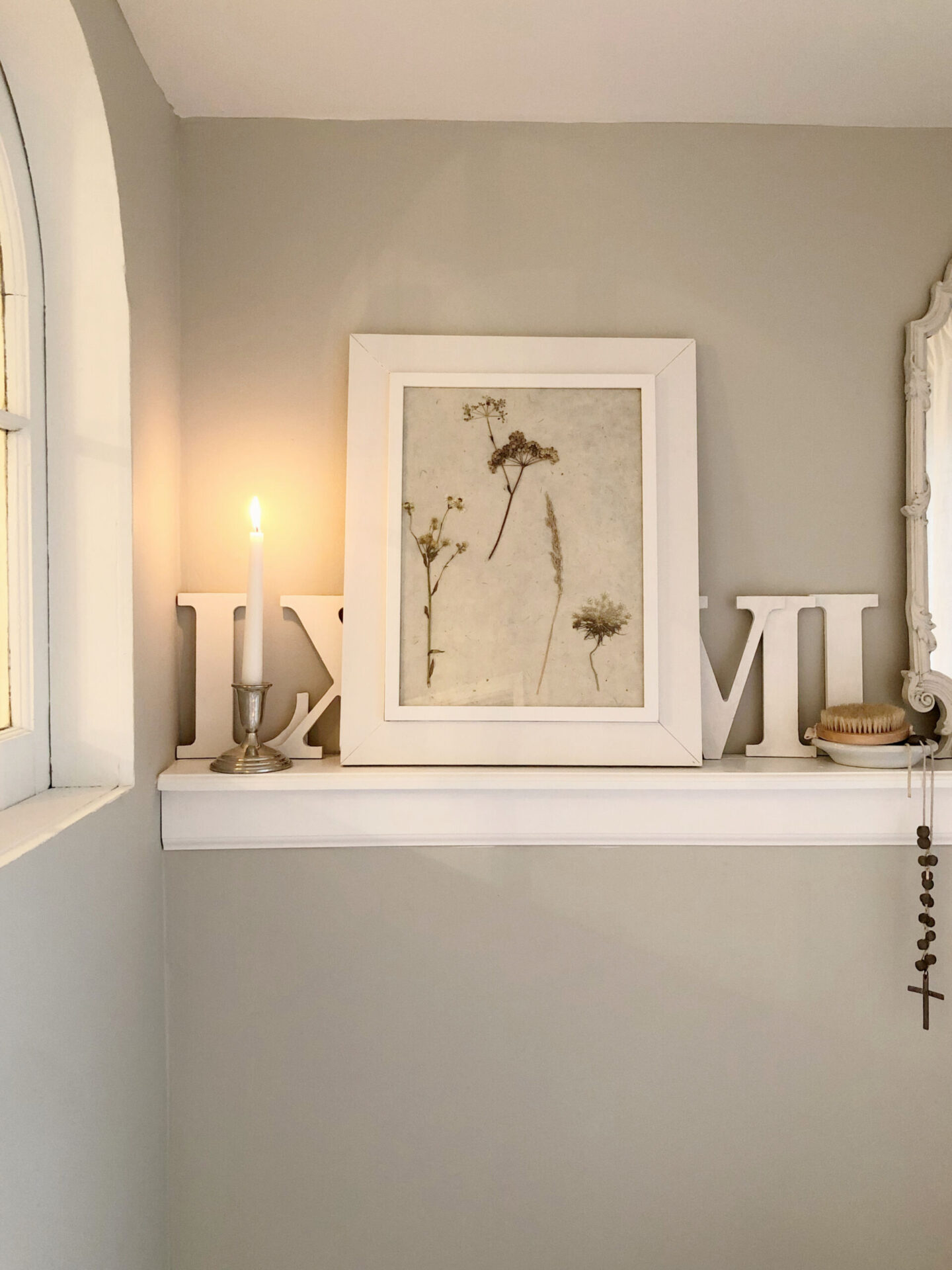 Hello Lovely's DIY renovated classic white bath with clawfoot tub and marble herringbone tile floor. Sherwin-Williams Repose Gray on walls. #sherwinwilliamsreposegray