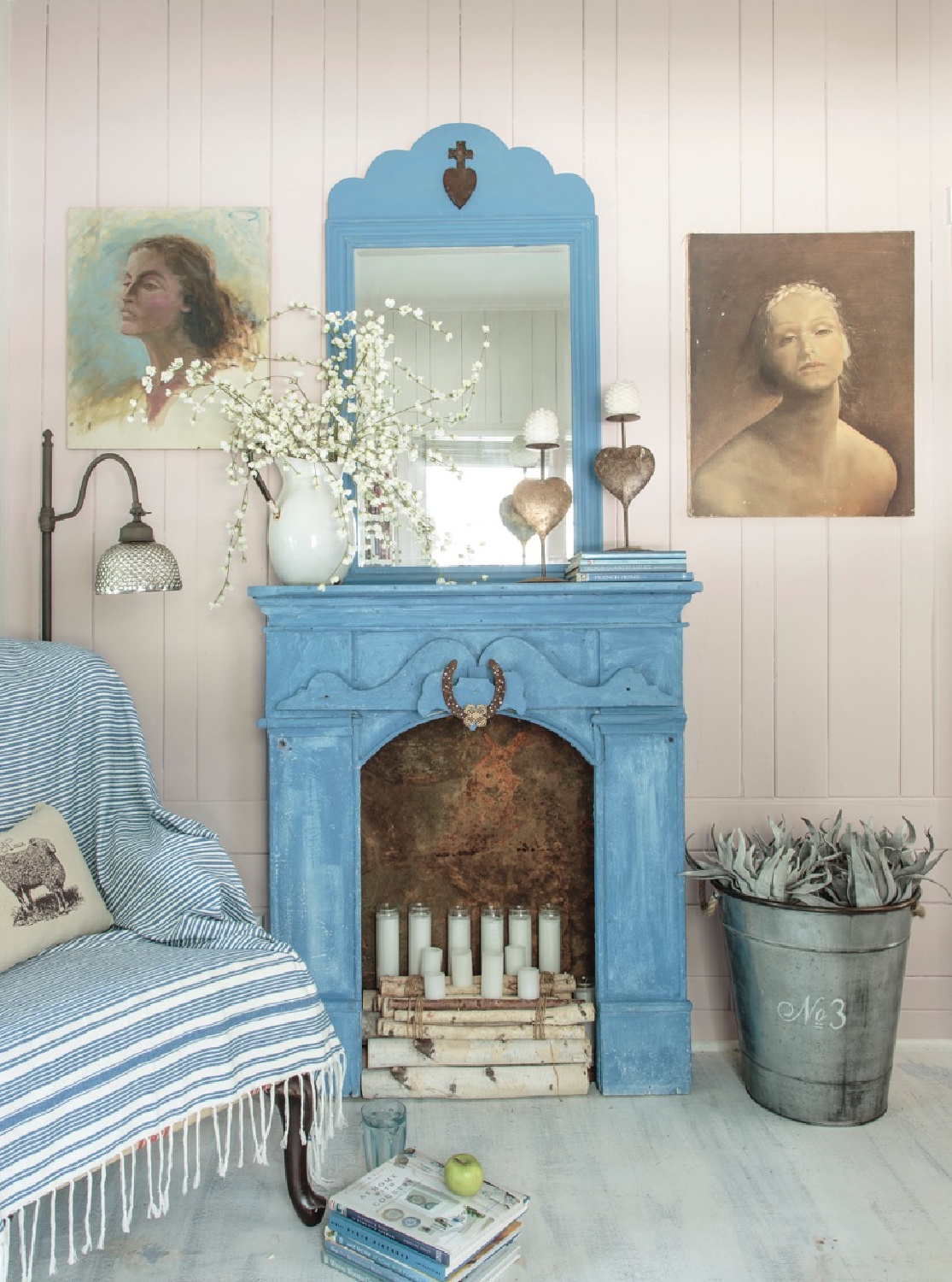 Charming French blue faux fireplace in Fifi O'Neill's Bohemian Florida cottage with romantic decor. #romanticcottage #countrycottage #romanticdecor