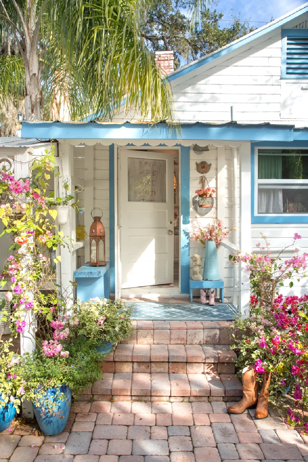 Fifi O'Neill's charming Florida cottage with turquoise trim and romantic decor. #coastalcottage #countrycottage #romanticdecor