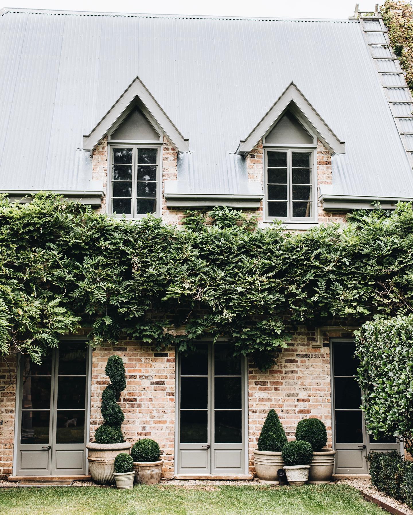 Lovely ivy covered brick exterior - from Melissa Penfold's Living Well by Design (photo: Abbie Melle). #ivycovered #houseexteriors