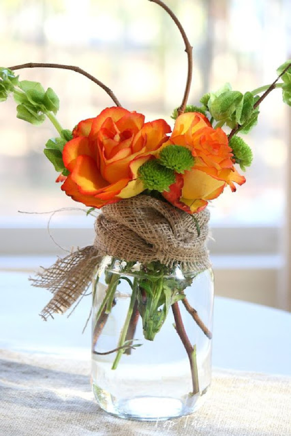 Simple fall floral with roses and burlap - Rosemary-Thyme. #fallflorals #fallcenterpiece