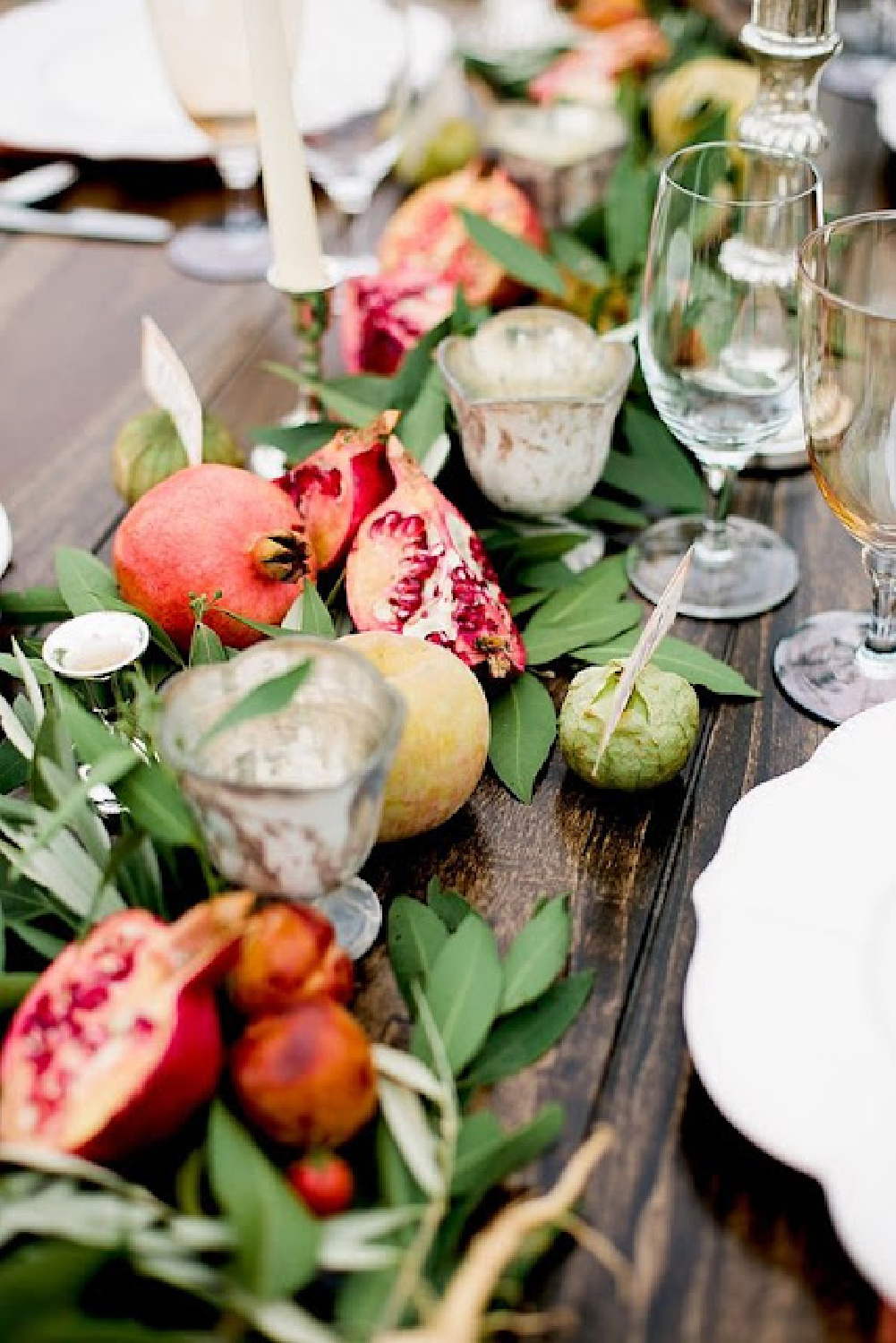 Fall tablescape with lush leaves, pomegranate, and pears - Rosemary-Thyme. #fallcenterpiece #falltablescape