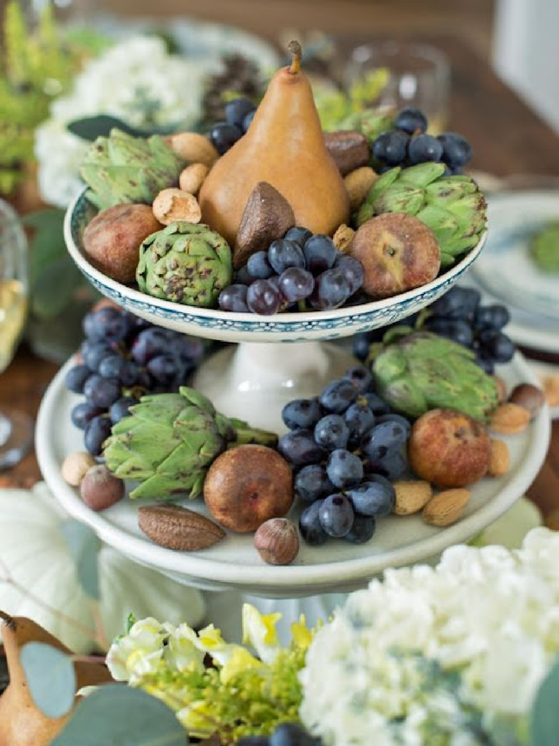 Fall tablescape with fruit, nuts, and artichokes on compotes - Rosemary-Thyme (Blogspot). #falltablescapes #fallcenterpiece