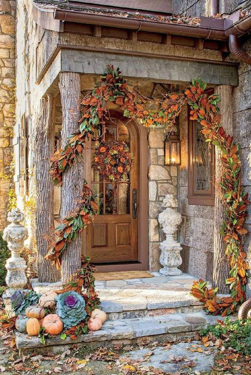 Fall front porch with beautiful garlands and old world style - Southern Living. #fallporch #oldworldstyle